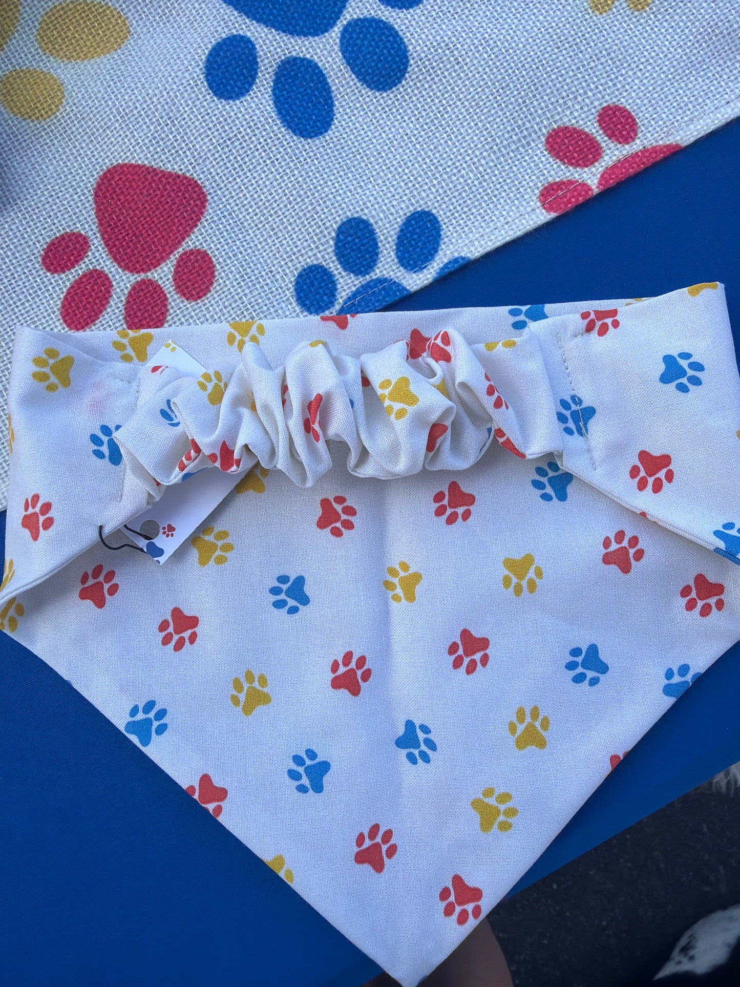 Red, yellow, & blue paw print scrunchie dog bandana
