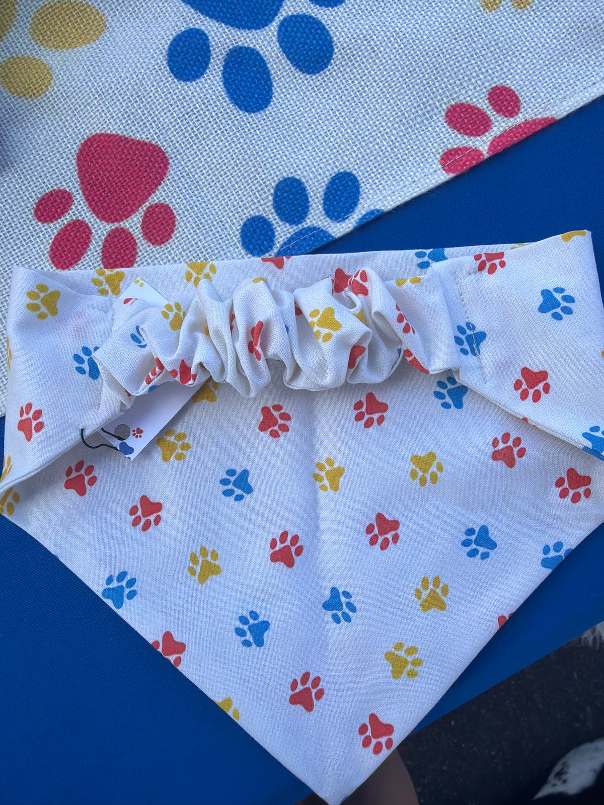 Red, yellow, & blue paw print scrunchie dog bandana