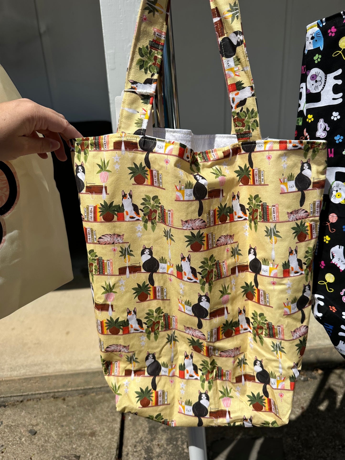 Yellow library cats tote bag